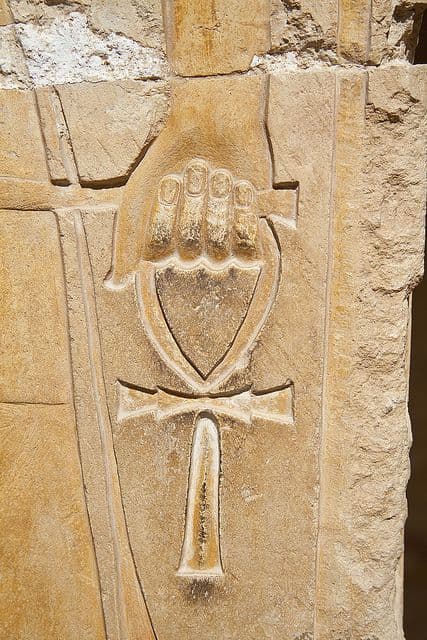 Carved stone hand holding an ankh